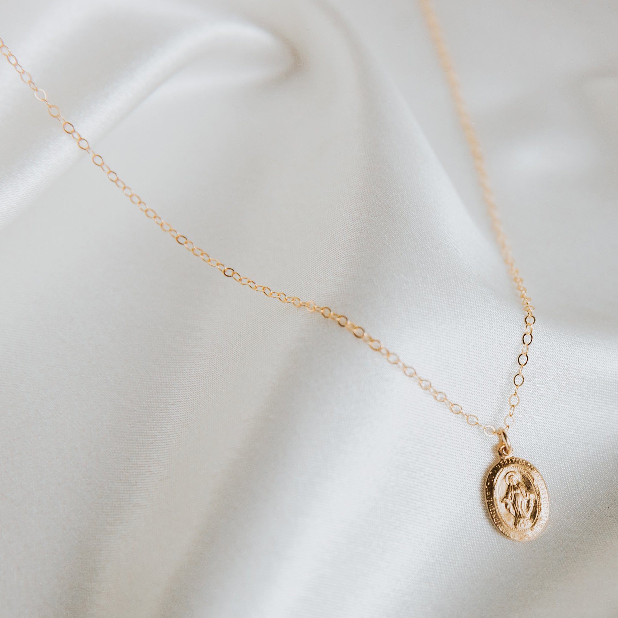 Tiny Oval Mary Medallion Necklace from Erin Fader Jewelry