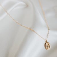 Tiny Oval Mary Medallion Necklace from Erin Fader Jewelry